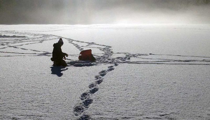 Experience the Thrill of Ice Fishing in the Canadian Winter Wonderland in Canada